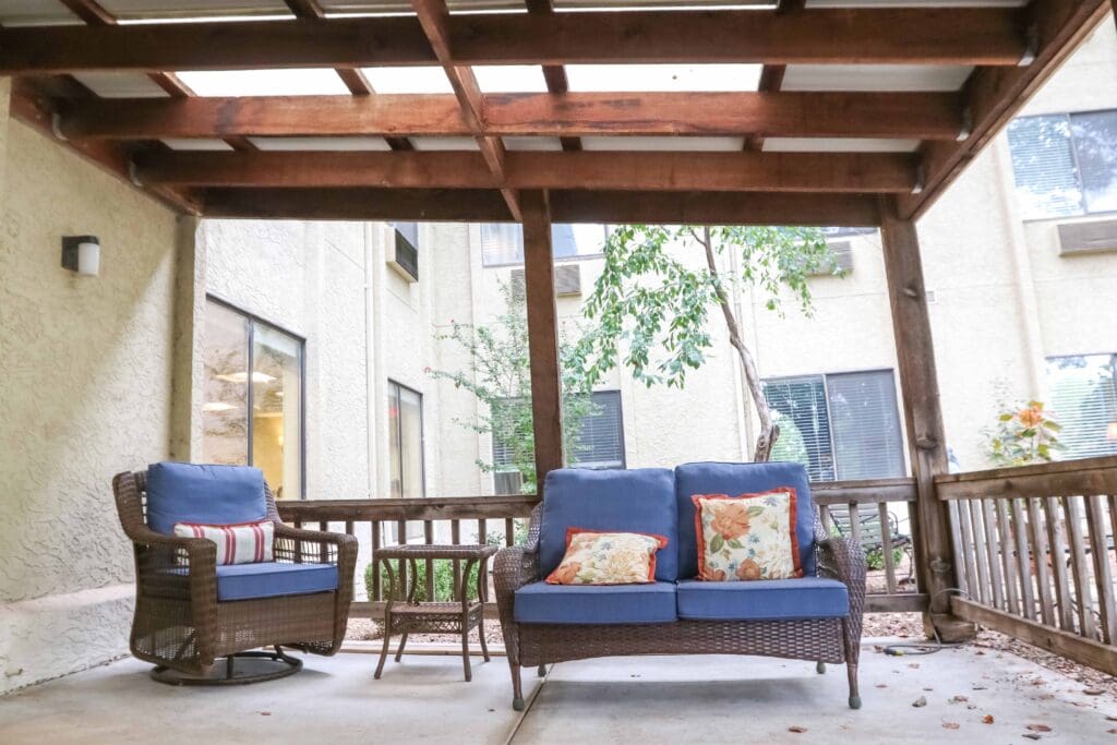 Exterior image of a patio area with comfortable outdoor furniture at Sedgwick Plaza.